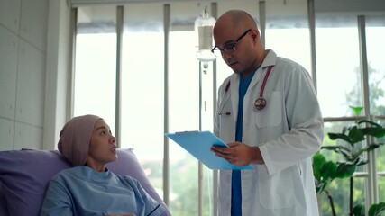 Young specialist doctor holding medical document clipboard and talking with
recording to the patient woman with cancer to diagnostic at hospital, doctor cheer up and giving hope to patient. - Powered by Adobe