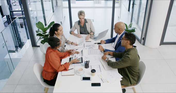 Meeting, group and business people with chart for planning, financial analysis and document above. Team, office and discussion in boardroom for investment, risk management or budget report with data - Powered by Adobe