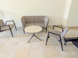 Elegant meeting room interior with round table and upholstered chairs creating professional atmosphere for business conferences