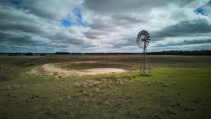 Solitary windmill in a rural landscape.