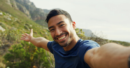 Selfie, hiking and happy man in nature for holiday, POV and travel influencer show mountain. Asian person, portrait and profile picture for trekking, adventure and photo for social media in Cambodia