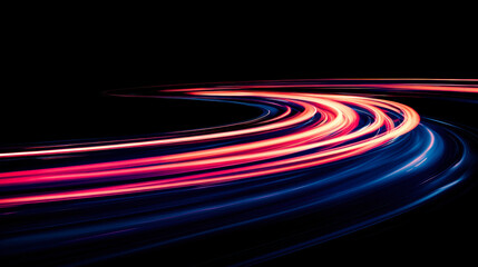 Colorful light trails create dynamic motion against a dark background in a vibrant display of energy and speed
