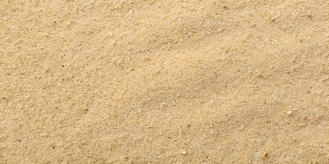 Photo of closeup of sand texture background, perfect for beach, desert, or naturethemed designs, showcasing the natural grain and detail of the golden surface