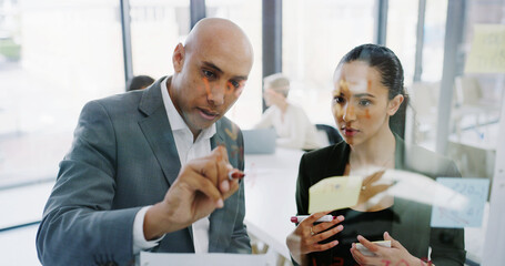 Writing, strategy or business people in office with glass for development, planning or teamwork. Window, ideas or analysts in meeting for solution, brainstorming or collaboration project in agency