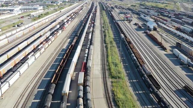 Aerial view of a vast railroad yard filled with trains and tracks