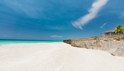 Varadero,Cuba, gorgeous inviting view on white sand majestic beach,tranquil,turquoise ocean with old volcanic cliff on the shore 