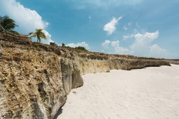 Varadero,Cuba, gorgeous inviting view on white sand majestic beach with old, naturally formatted volcanic cliff on the ocean shore 