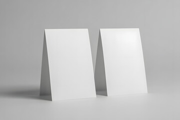Two blank white table tent cards mockup isolated on white background for design template