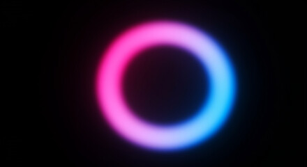 Naklejka premium Softly blurred neon ring with pink and blue gradient on a black background circle bokeh