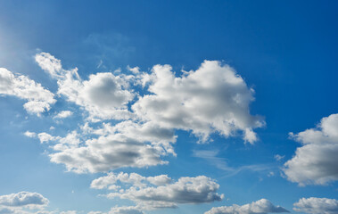 Background with clouds on blue sky. Beautiful sunny sky.
