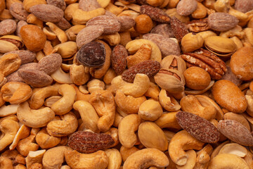 A group of almonds, pistachios, walnuts, macadamia, cashews.