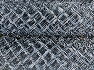 Texture of Chain-link fence or chainwire. Metal Chainlink fence, close-up.