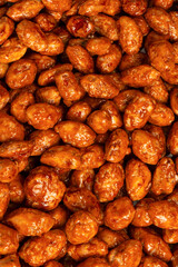 Tasty sweet roasted peanuts as a background.