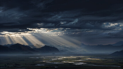 Dramatic sunlight breaks through dark storm clouds over a vast valley with winding river at dusk