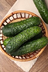 Fresh cucumbers on wooden table, flat lay