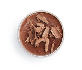 Delicious chocolate panna cotta in glass isolated on white, top view