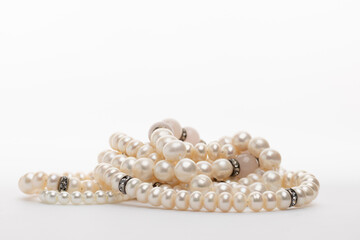 White pearls arranged in a cluster, reflecting light