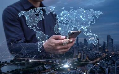 Man holding smartphone with glowing digital world map overlayed on a cityscape at night representing global connectivity and technology