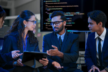 Diverse team of AI engineers strategizing on an autonomous system's architecture. Concept for...