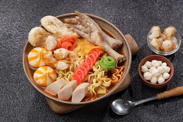 Seblak is a spicy culinary dish from West Java containing crackers, noodle, and chicken feet with the main spice kencur.
