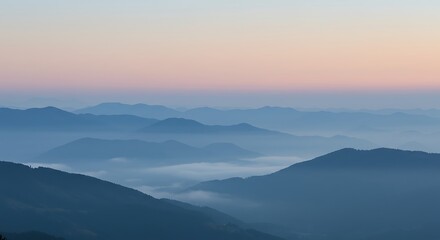 Fototapeta premium Misty mountain horizon at dawn, cool blue and gray tones, serene backdrop