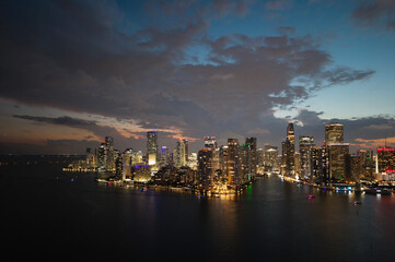 Aerial night view of Brickell skyline in downtown Miami. Skyscrapers above Miami. Scenic panorama...