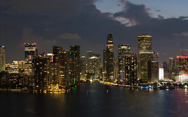 Aerial night view of Brickell skyline in downtown Miami. Skyscrapers above Miami. Scenic panorama of Brickell financial district. Brickell in Miami city. Brickell Urban landscape.