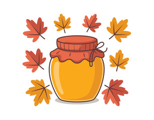 Jar of golden honey surrounded by autumn leaves