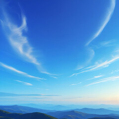 Naklejka premium Fluffy white clouds drift across a beautiful blue sky over mountains on a clear summer day