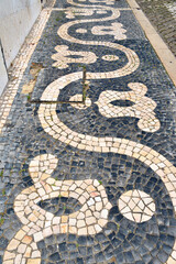 typical Portuguese pavement, known as calçada portuguesa, which is a distinctive element of Lisbon Portugal