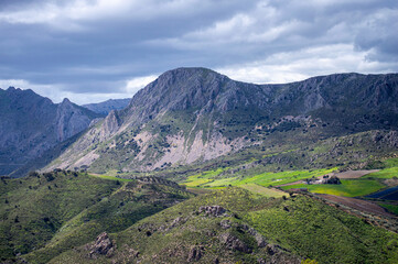 Fototapeta premium Scenic nature surrounds the hiking trails, offering stunning views and peaceful outdoor experiences in Sierra Tejeda Natural Park, Spain