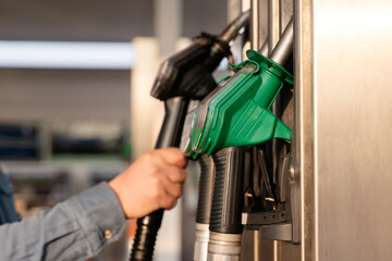 Drivers filling their cars with fuel at gas petrol station, utilizing various pumps that supports daily commuting needs and travel plans