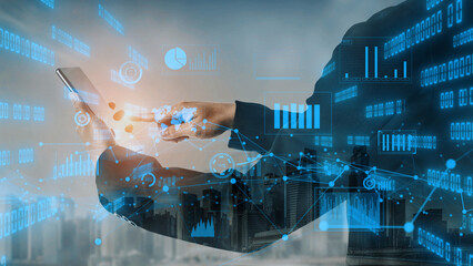 A business professional engages with a smartphone in a dynamic urban setting. Digital overlays of data and charts suggest a focus on technology and analytics in finance. Xenic