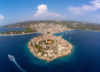 Aerial panorama of the tourist town of Primosten in Croatia. Aerial view of the landscape with the village and the Croatian Adriatic coast in summer