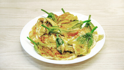 Delicate zucchini blossoms in golden batter, artfully fried to perfection, showcasing vibrant garden freshness, seasonal gourmet delicacy, rustic yet refined culinary presentation