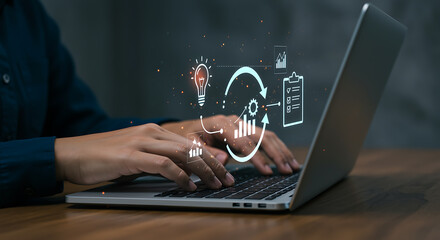 Person typing on laptop with digital business process icons