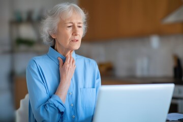 Senior woman with a sore throat seeking a telehealth consultation via laptop