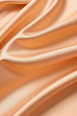 Obraz premium orange golden silk satin fabric background