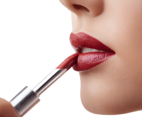 Woman with perfect red lipstick, applying makeup for a glamorous look.