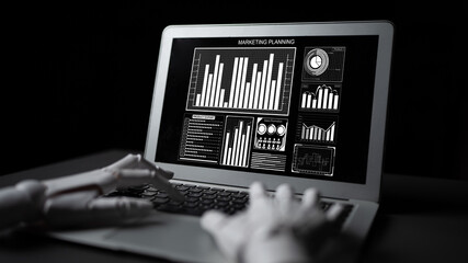 A robotic hand interacts with a laptop showing detailed marketing planning data visualizations. The dark backdrop highlights the modern technology and insights presented. Impute