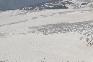 The cracked Bolshoi Azau glacier on the slopes of Elbrus in midsummer