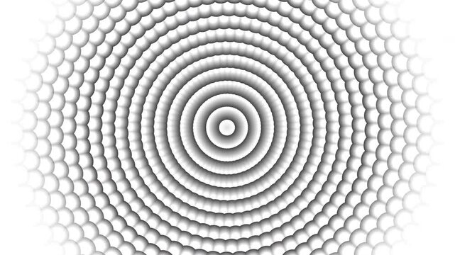 Silver circle concentric rings of tiny white spheres create a shimmering ripple effect