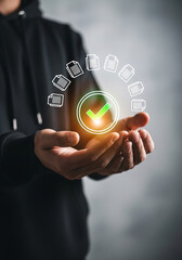 Photo of person holding a digital check mark surrounded by document icons representing efficient workflow management