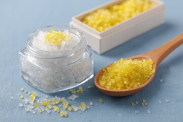 Different colored crystals of bath salt in glass containers.