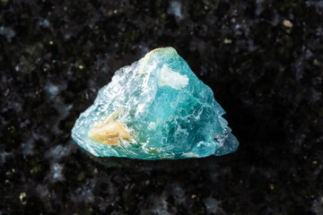 sample of raw grandidierite crystal on black