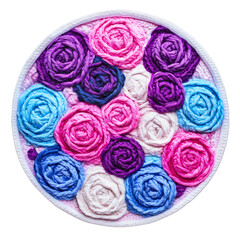 Isolated round embroidery of colorful roses, a handmade craft with intricate needlework, a beautiful and romantic floral design for a vintage home decor patch