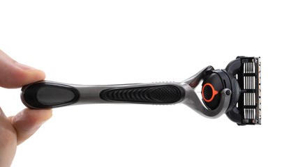 Close-up view of a modern razor handle held by a hand in a bright setting showing a clean design and sharp blades