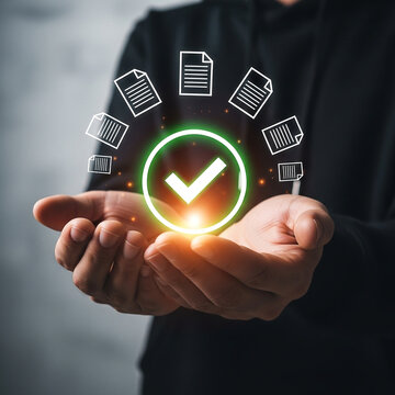 Photo of a person holding their hands out with a glowing check mark and document icons floating above them representing approval