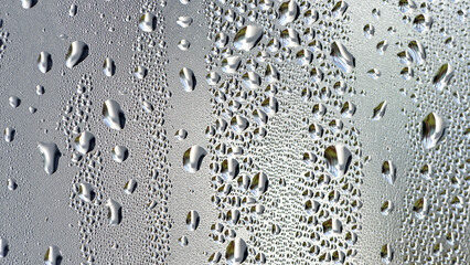 background, unusual, abstract. drops of morning dew, condensation on the glass. wet glass. water drops close-up. beautiful background for text. Spray cool condensate water on the glas