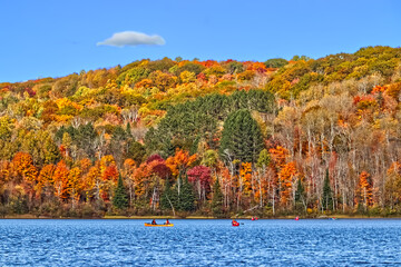 Perfect boating fall season on the still lake.